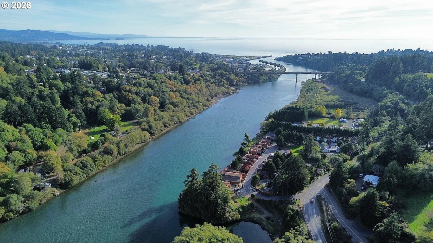 The Chetco River flowing past Brookings toward the harbor and the Pacific Ocean
