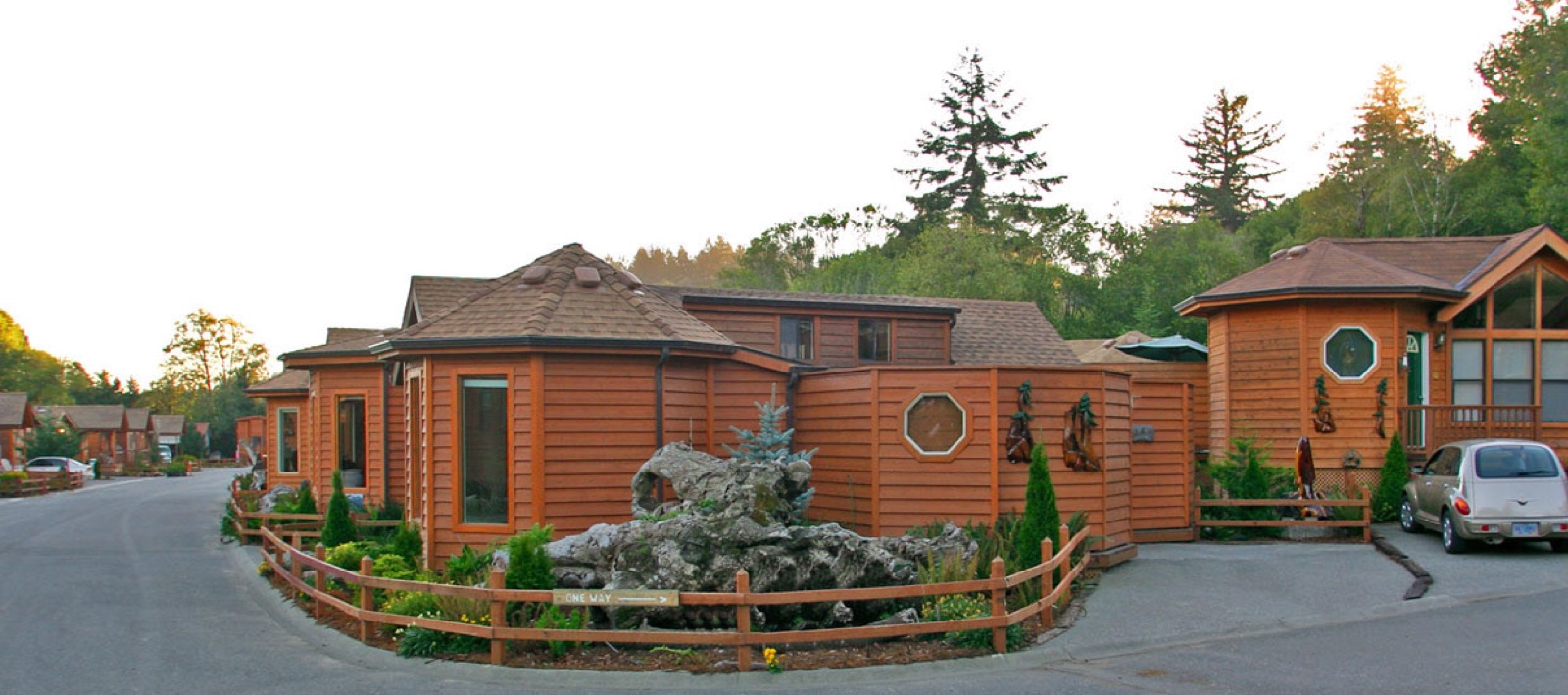 Cedar homes and landscaped street inside Chetco River Resort