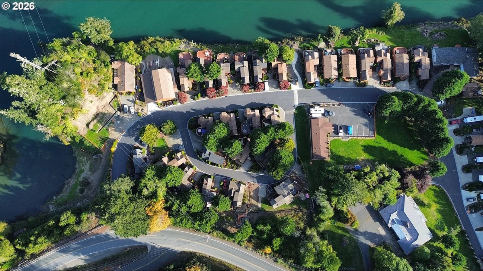 Top-down aerial view of homesites and the river at Chetco River Resort